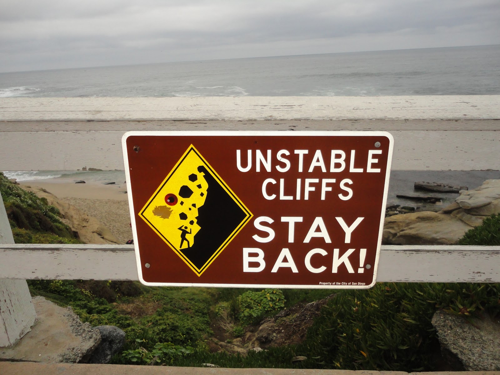 Sign says UNSTABLE CLIFFS STAY BACK